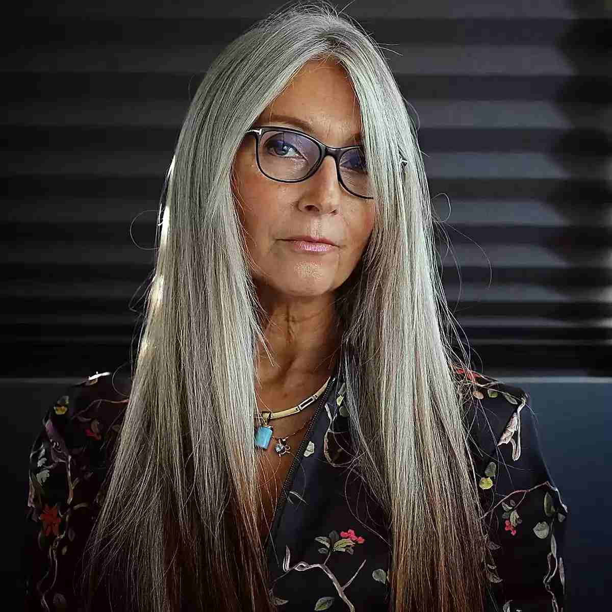 Sleek Long Hair with Long Bangs and Face Frame for Ladies Over 50 Wearing Glasses