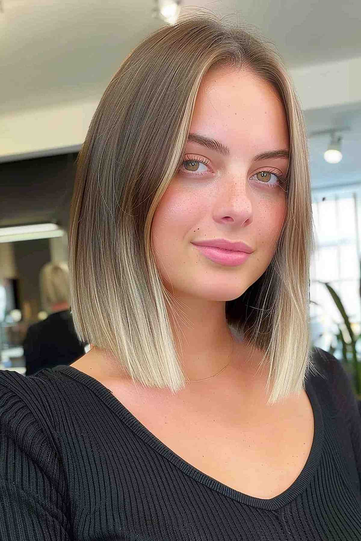 Collarbone-length sleek ombre lob to flatter round facial features.