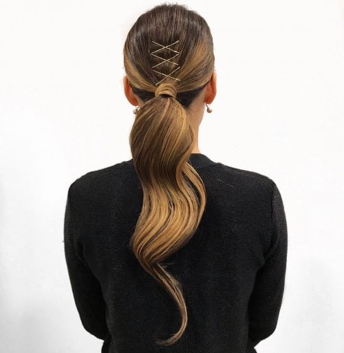 Sleek ponytail with bangs