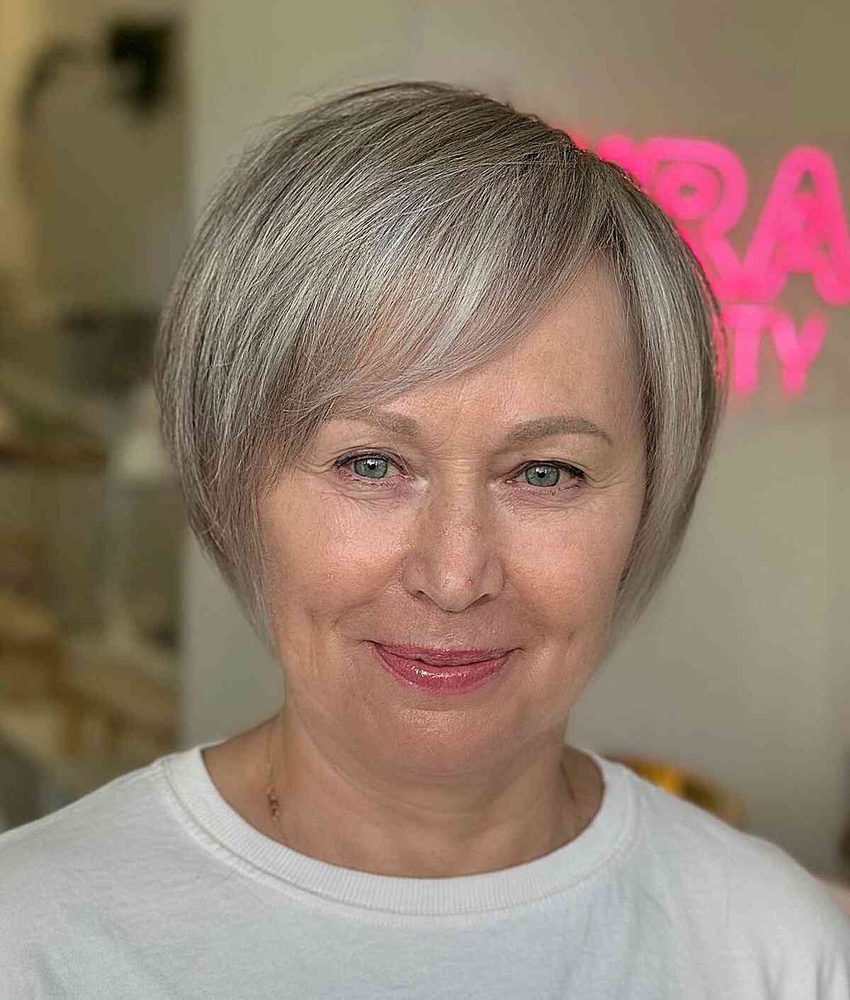 Sleek Short Layered Crop with Side-Swept Bangs for Older Women Over 60