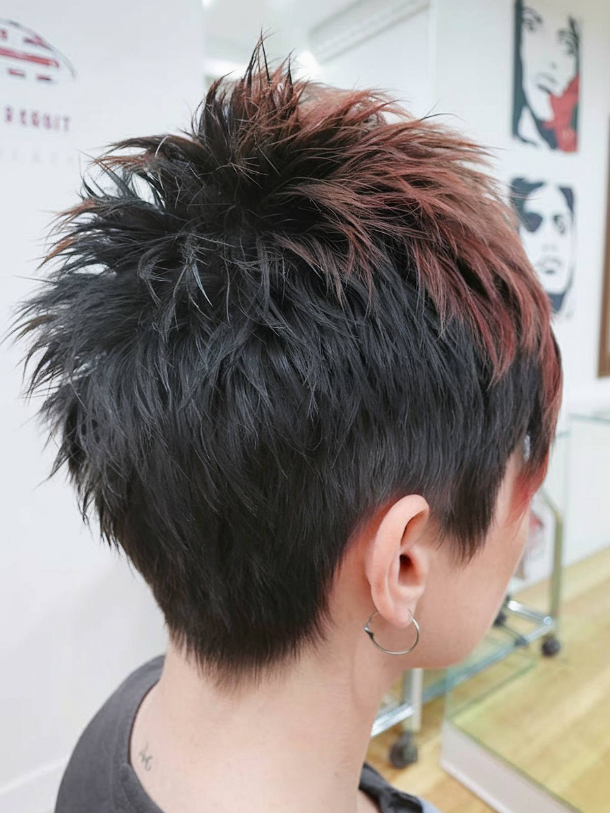 Back view of short spiky haircut with red highlights