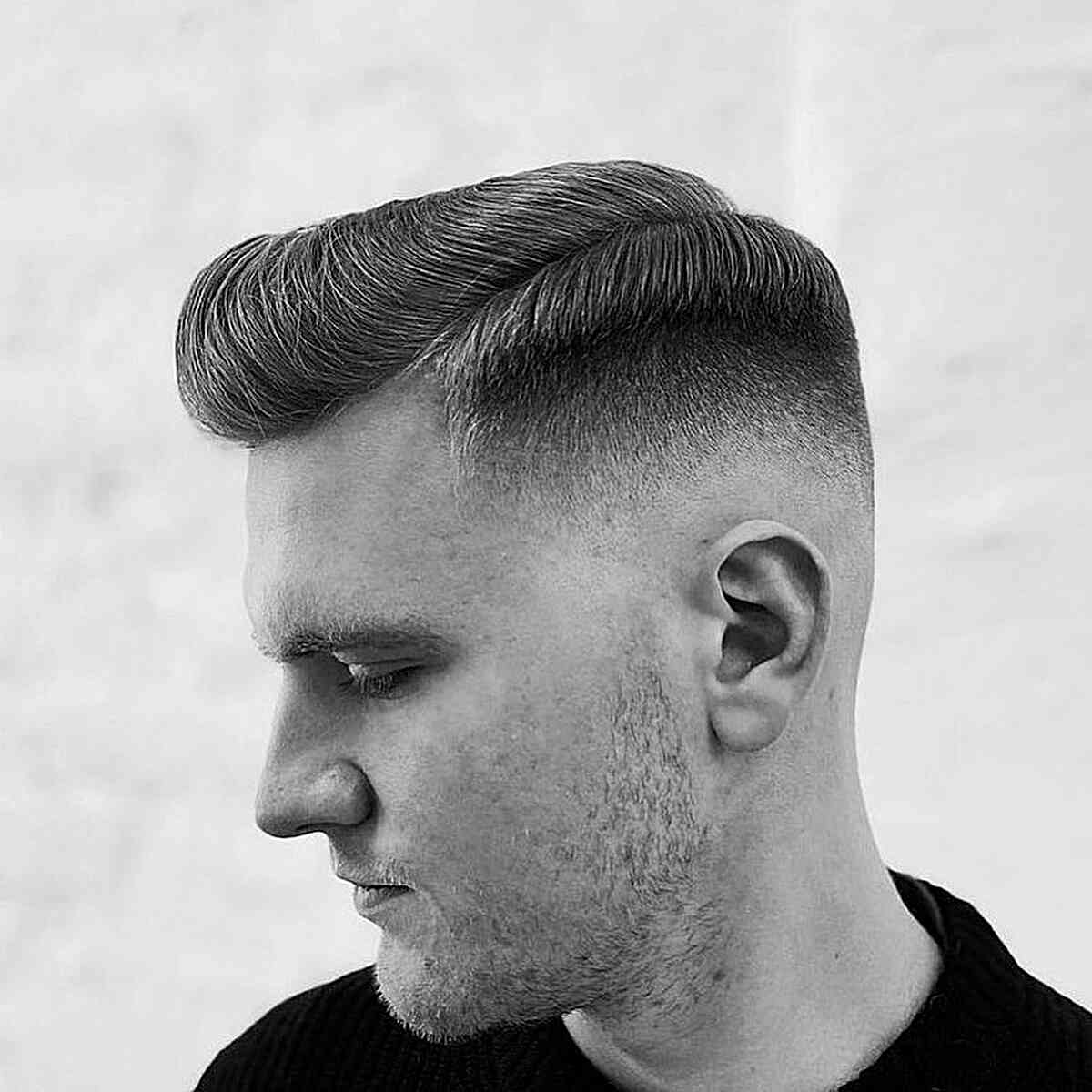 Sleek Side Part Undercut for Guys' Straight Locks with a skin fade