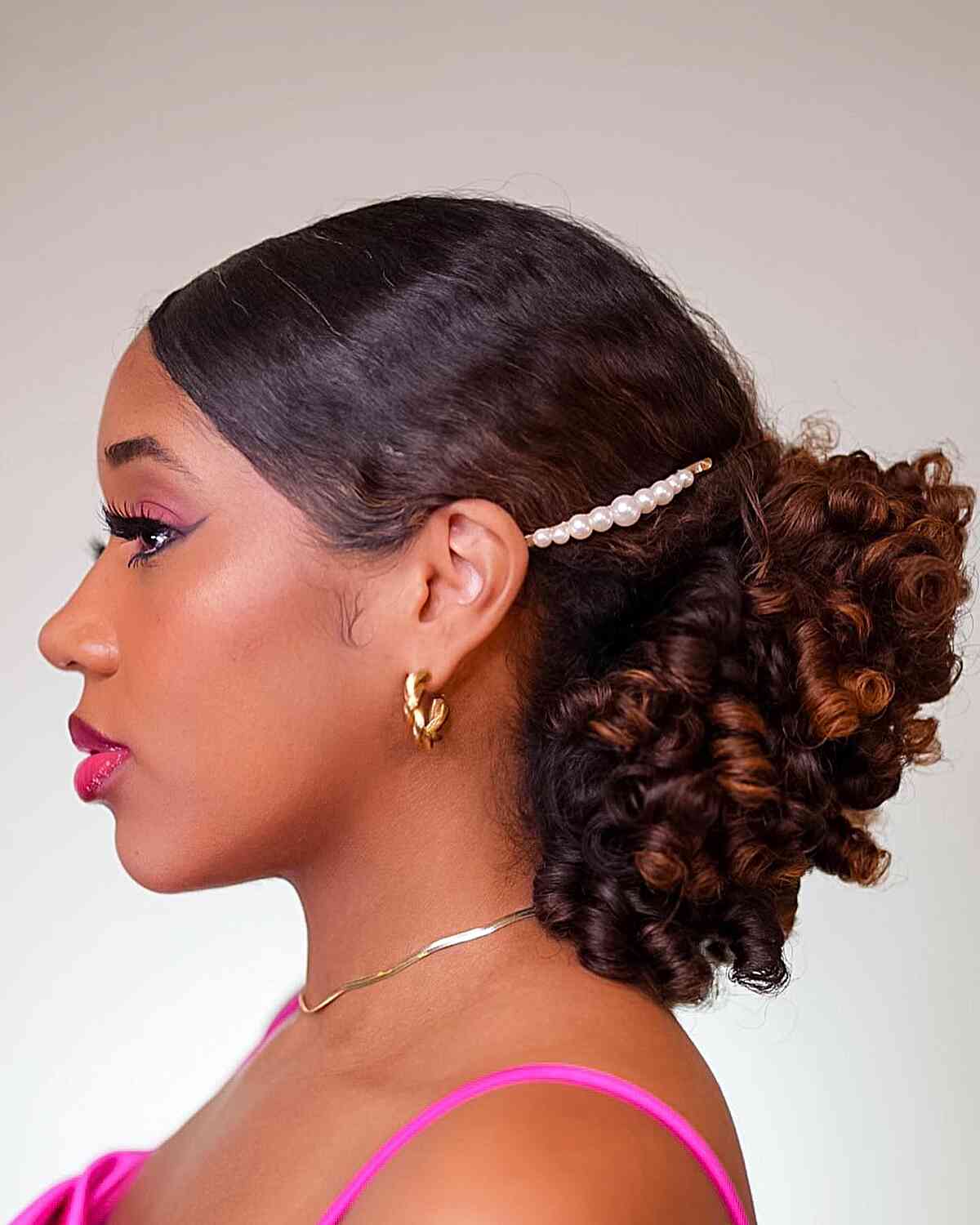 Sleek Updo with Coils for Black Ladies' Short Hair