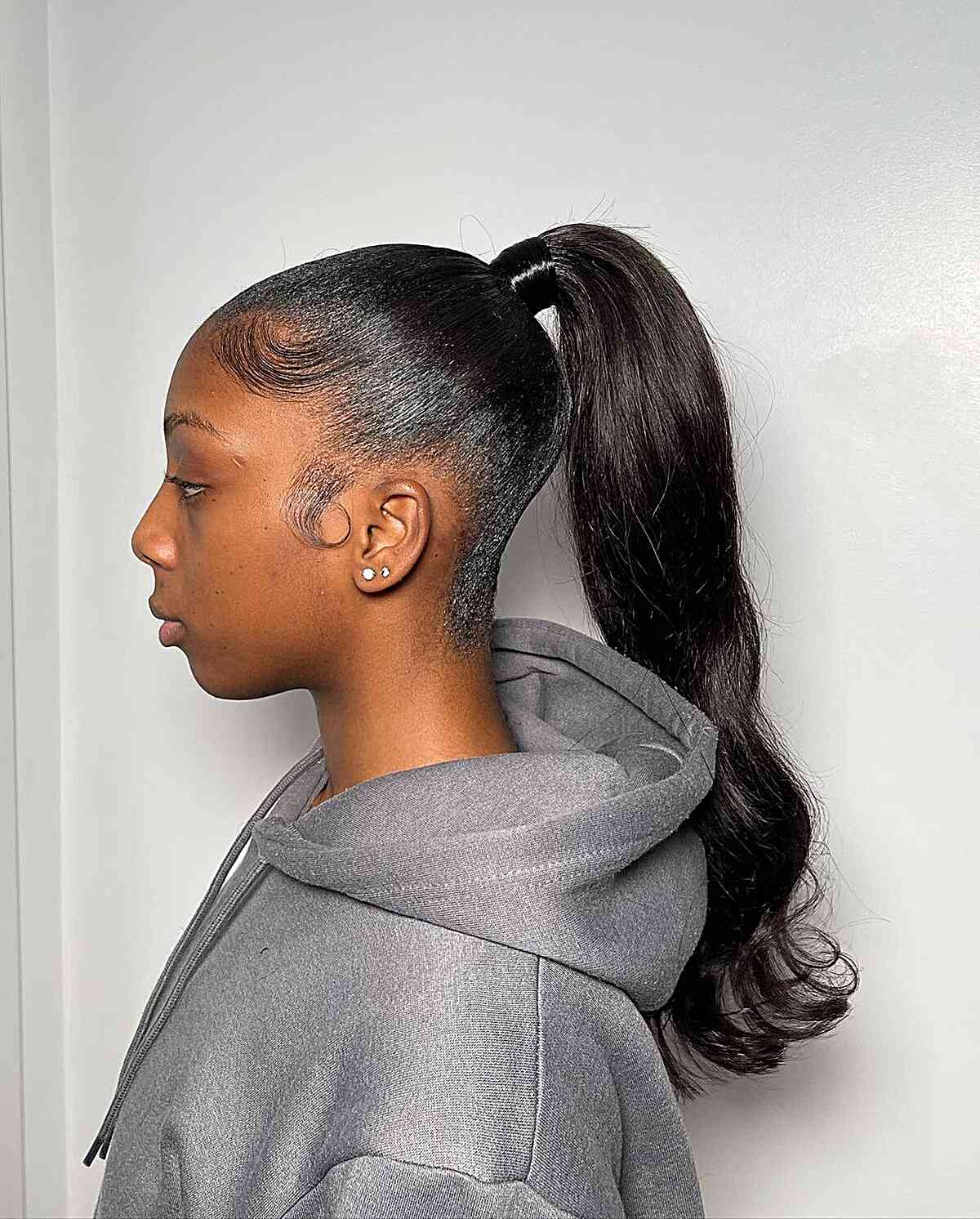 Sleekest Fountain Ponytail with Loose Waves