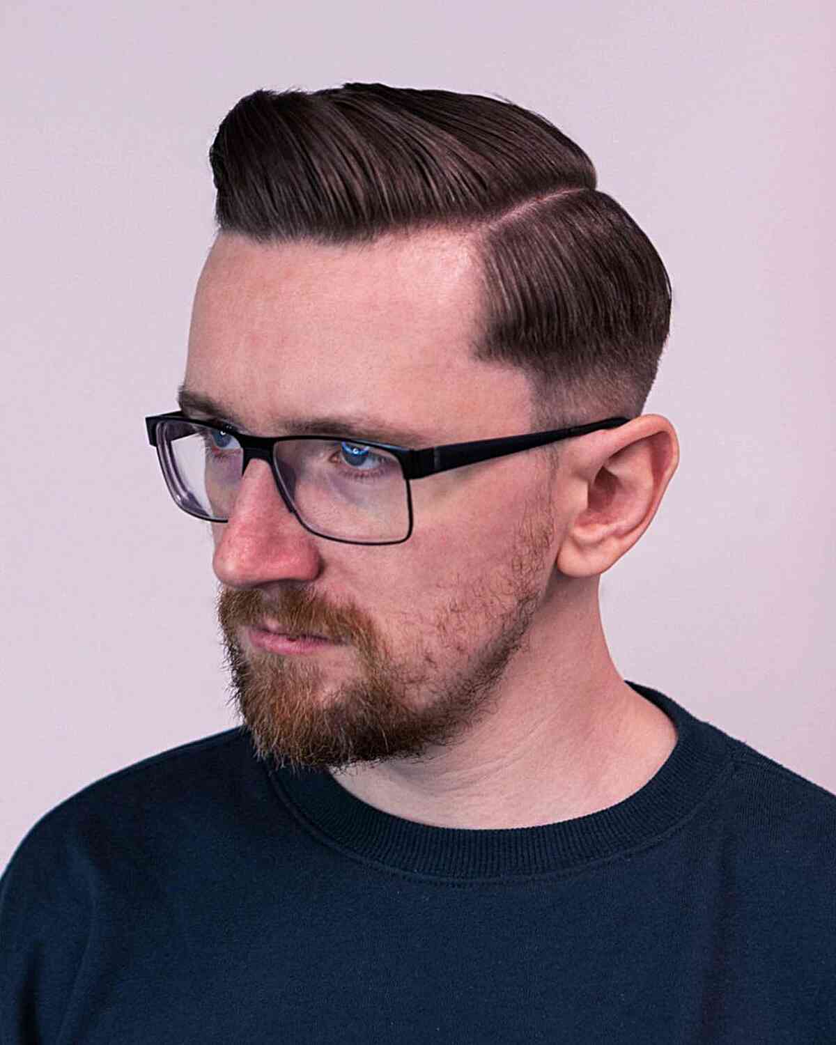 Slick Hard Part Side Part for Men with Glasses and a Beard with a Low Fade