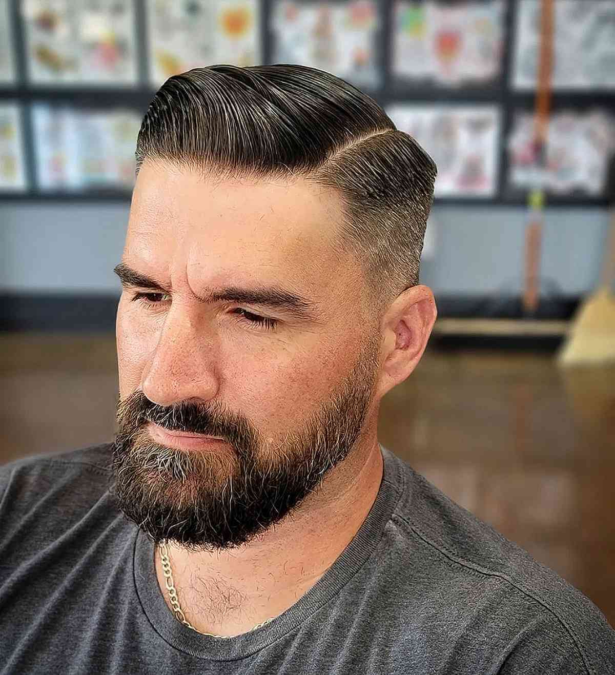 Slicked Back Combover with a Beard Fade for Men