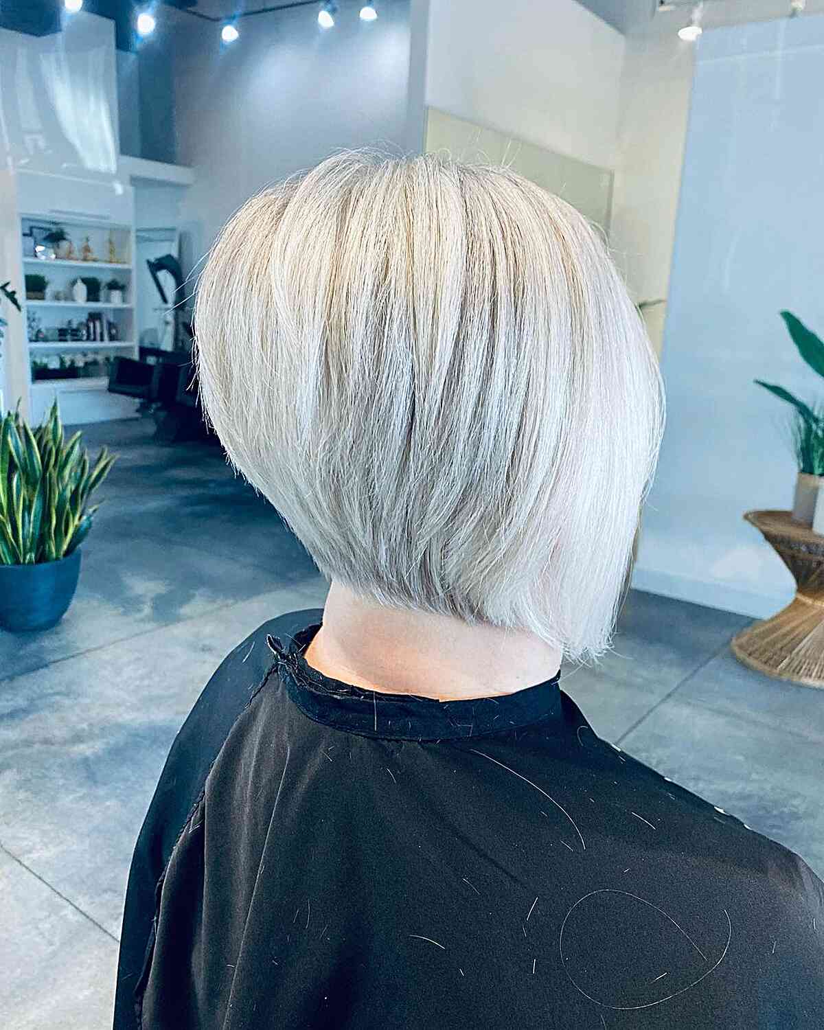 Slightly Stacked Platinum Bob for Thick Hair and women with a short edgy style