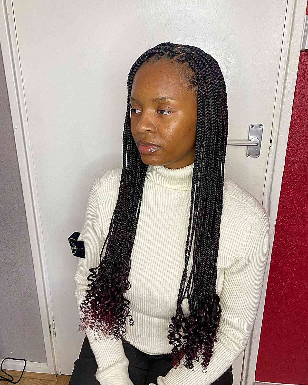 Long-Length Small Knotless Braids with Soft Red Tips