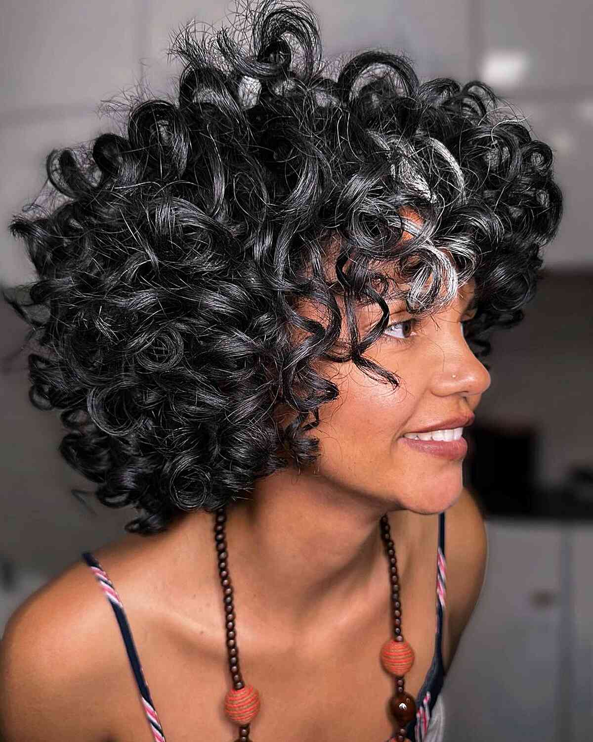Soft & Relaxed Natural Curls for African-American Women with long curly hair and bangs