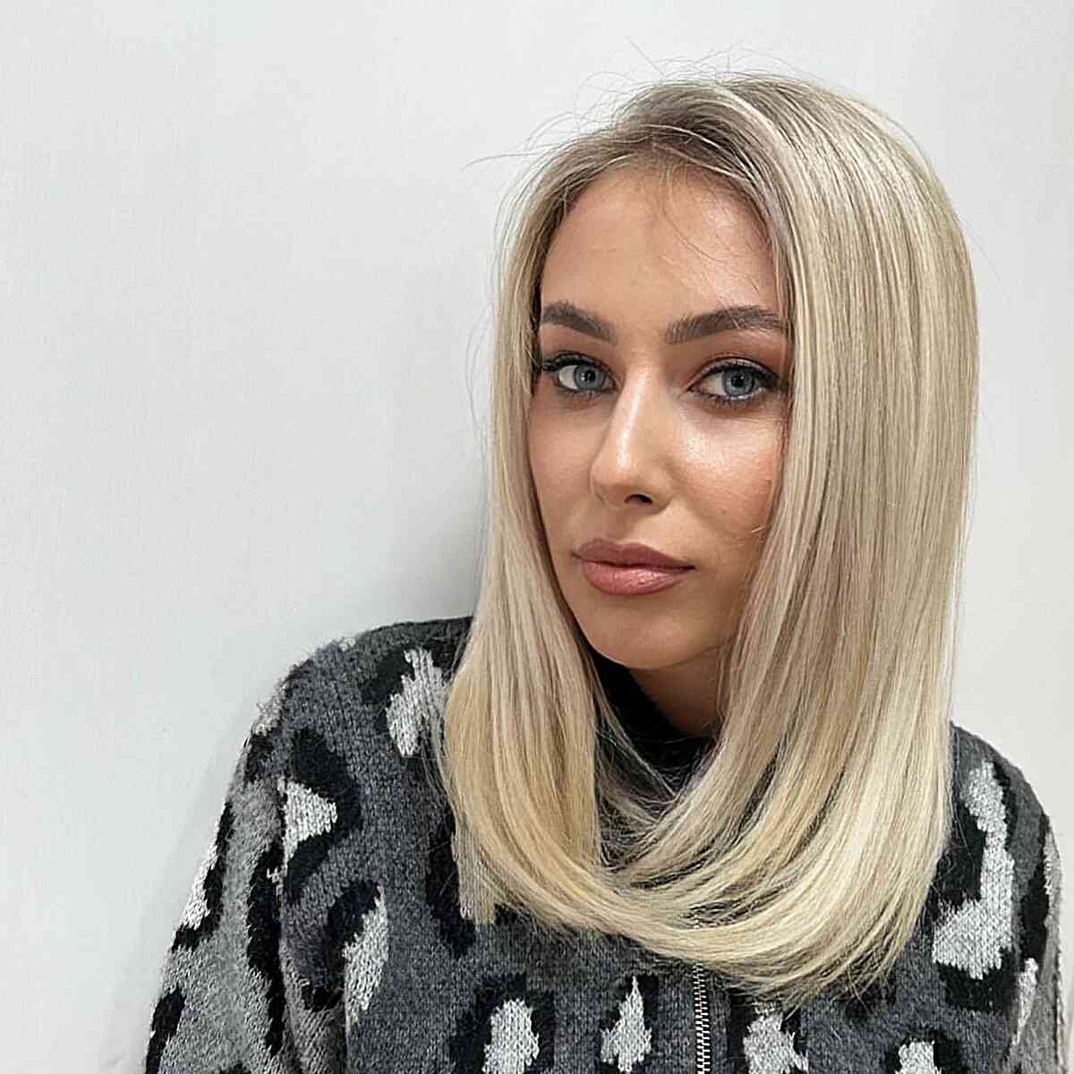 Soft Blonde Medium-Length Haircut Without Bangs for Straight Hair