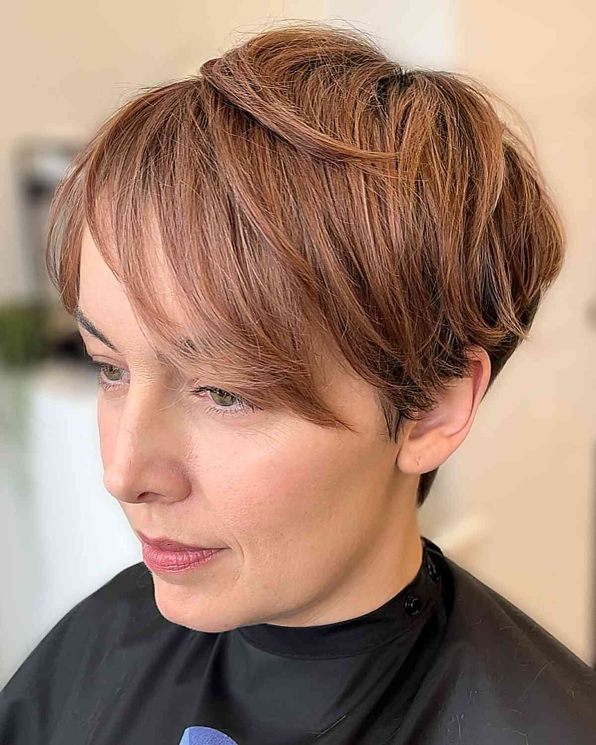 Soft Brown Piecey and Layered Pixie Cut for Fine Hair with Long Side-Swept Bangs 
