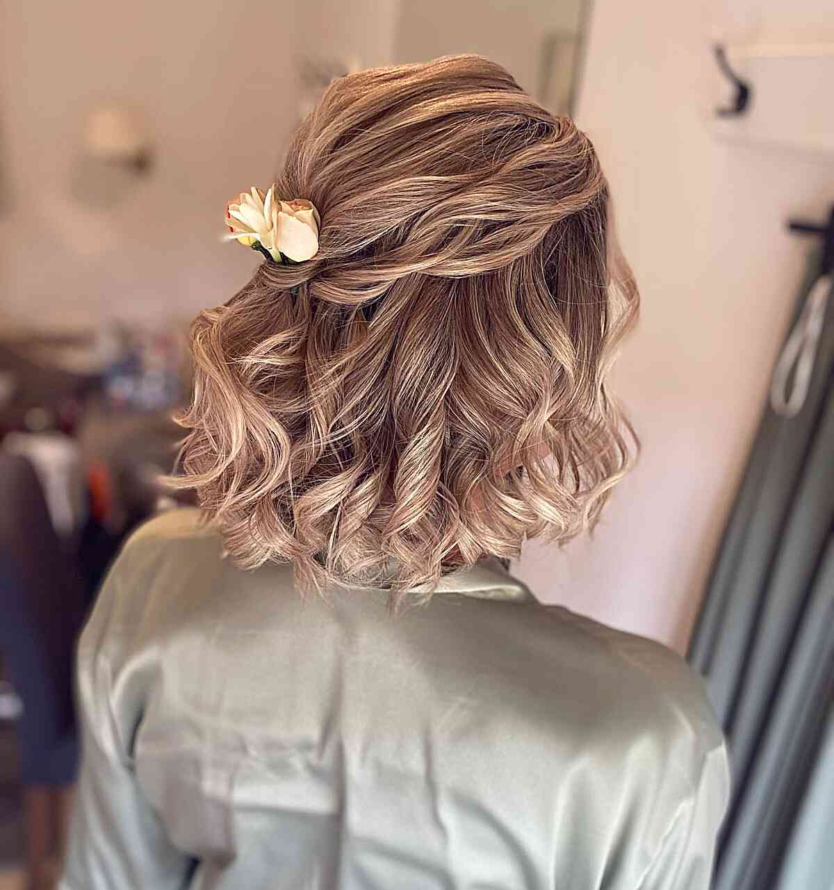 Soft Half Updo with Airy Curls and Rose Hair Pieces on Dark Blonde Hair