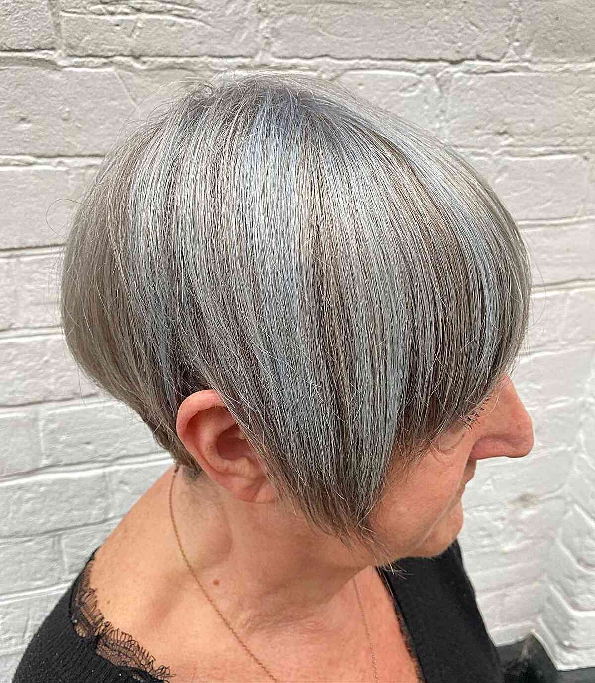 Soft Pastel Blue Highlights on Short Natural Grey Hair for Older Women