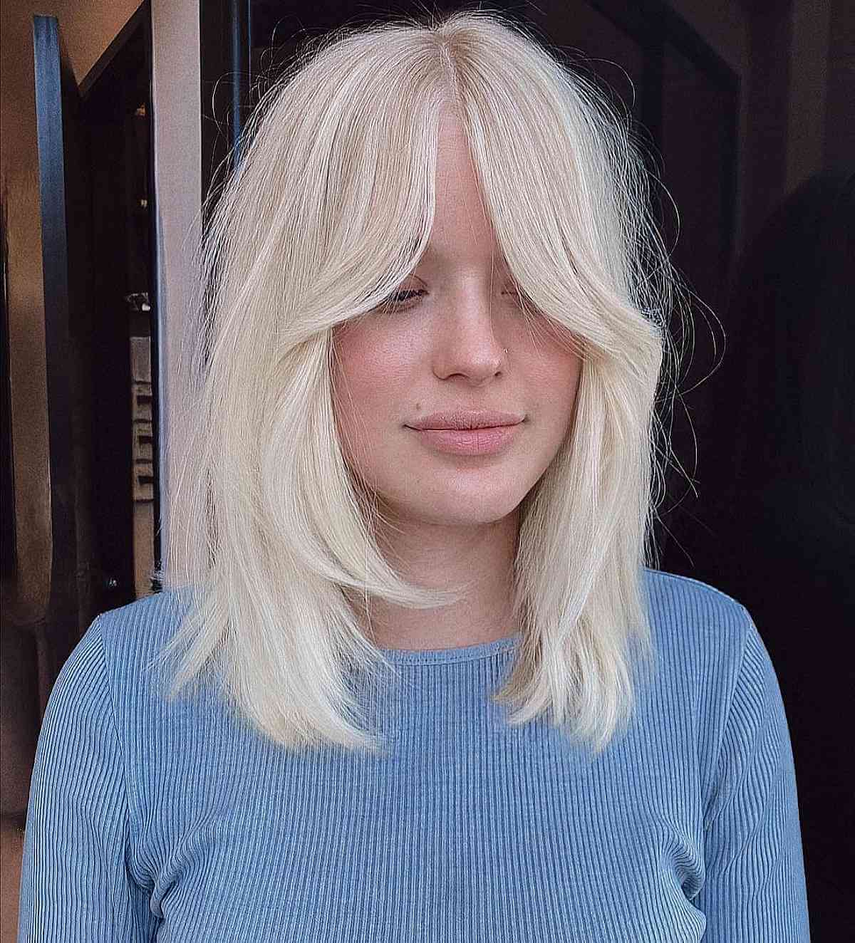 Soft Shag Cut with Face-Framing Layers and Bottleneck Bangs