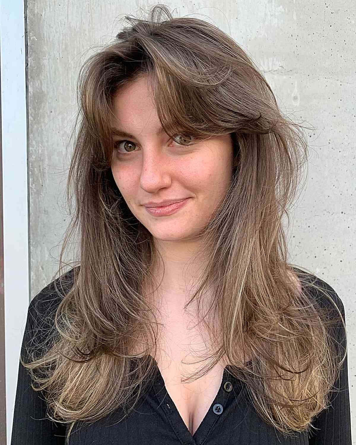 Mid-Length Soft Tousled Layers with French Voluminous Bangs
