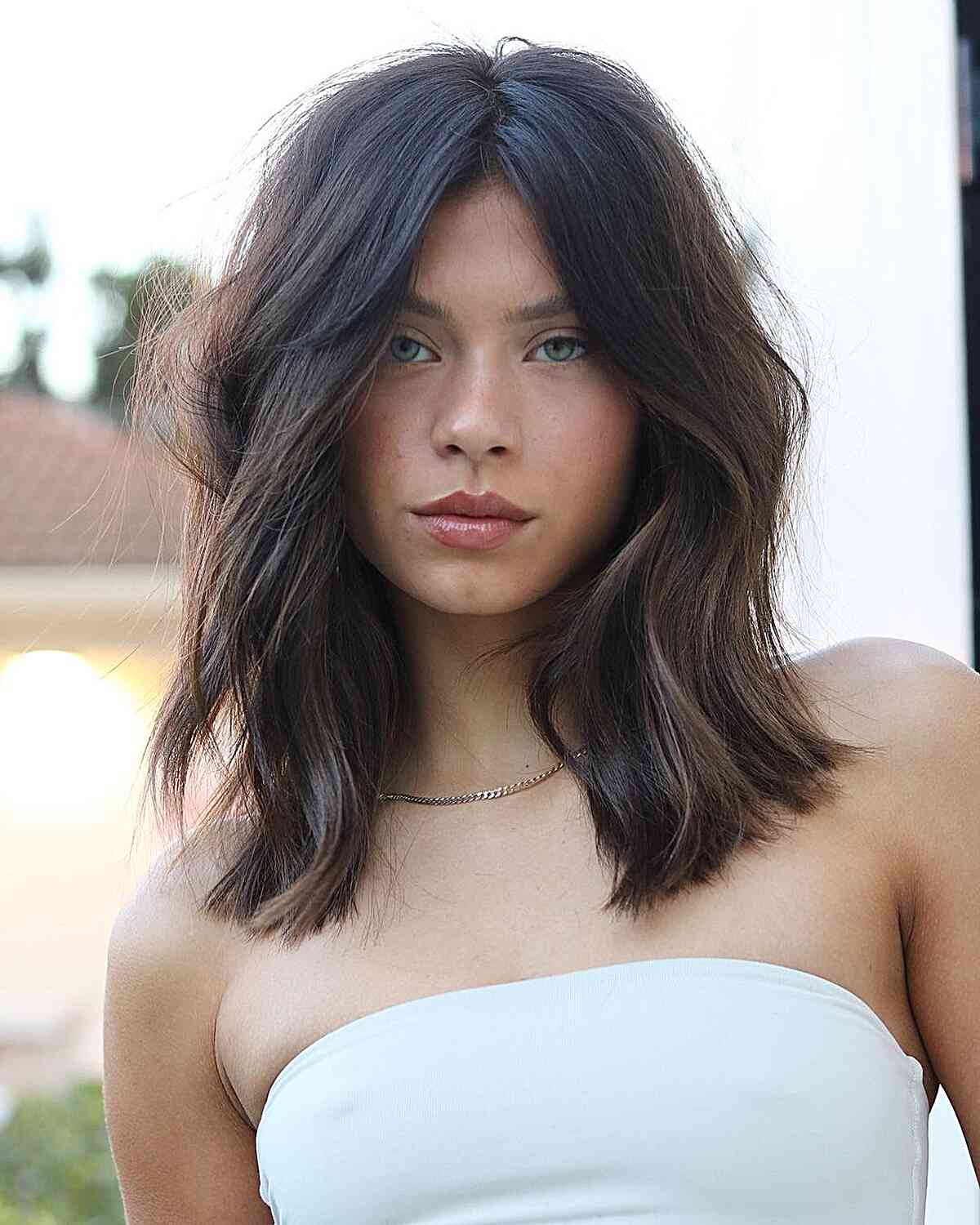 Soft Waves on Collarbone-Length brunette Thick Hair with no bangs