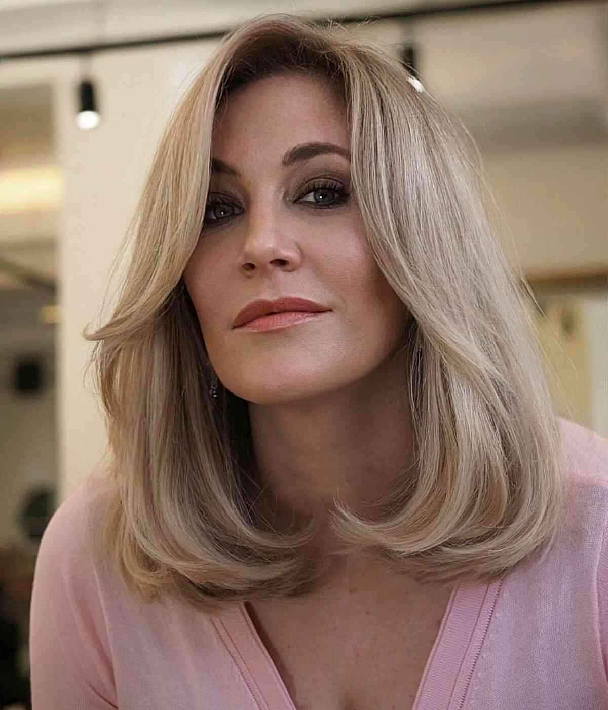 Sophisticated Mid-Length Blonde Cut for Women Aged 40