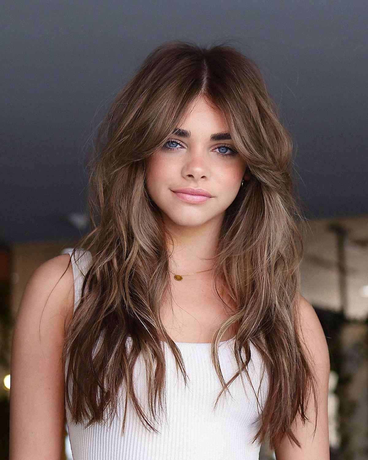 sophisticated wavy style for brown hair with highlights