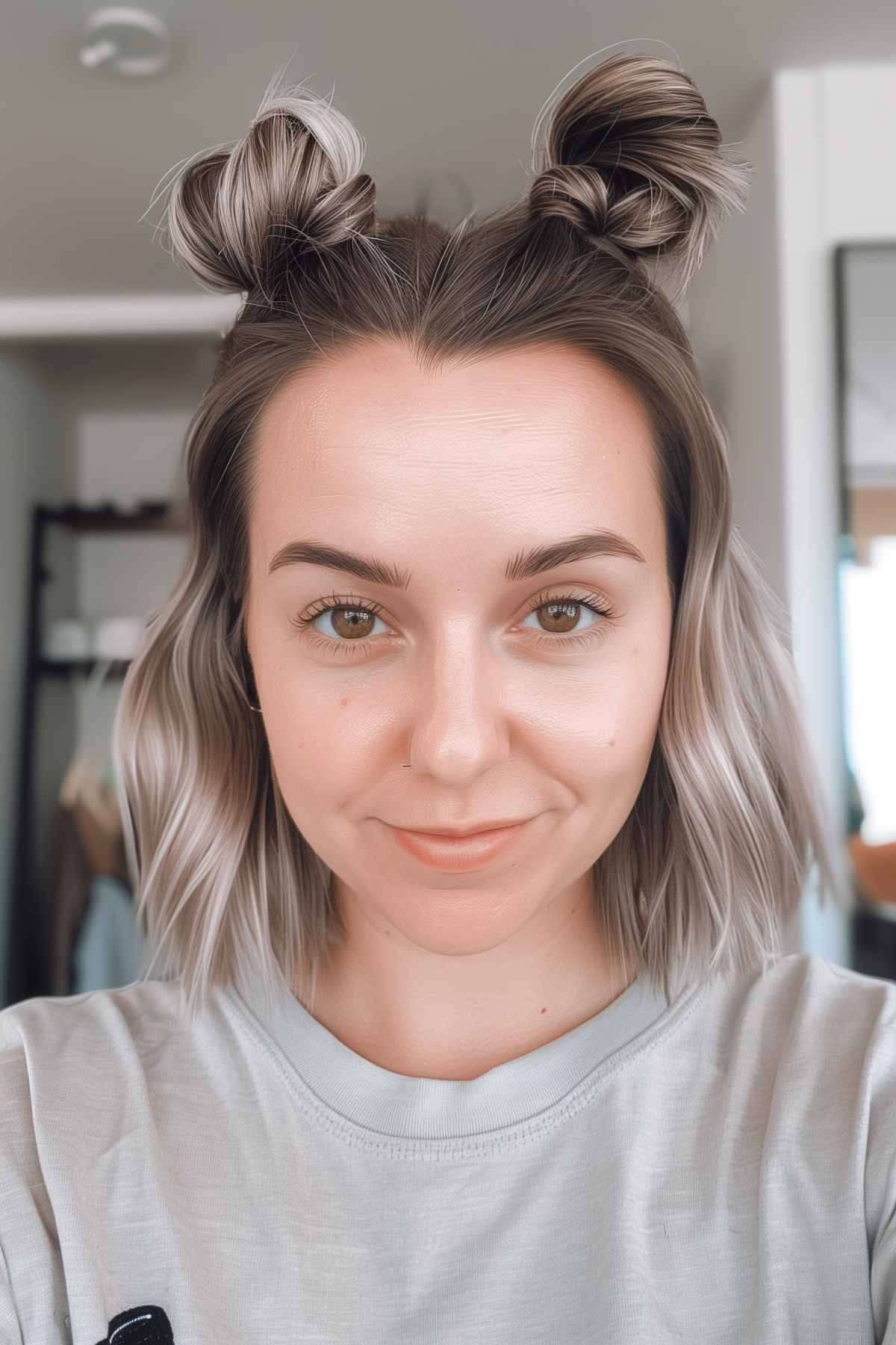 Space buns hairstyle for shoulder length hair, ideal for gym workouts