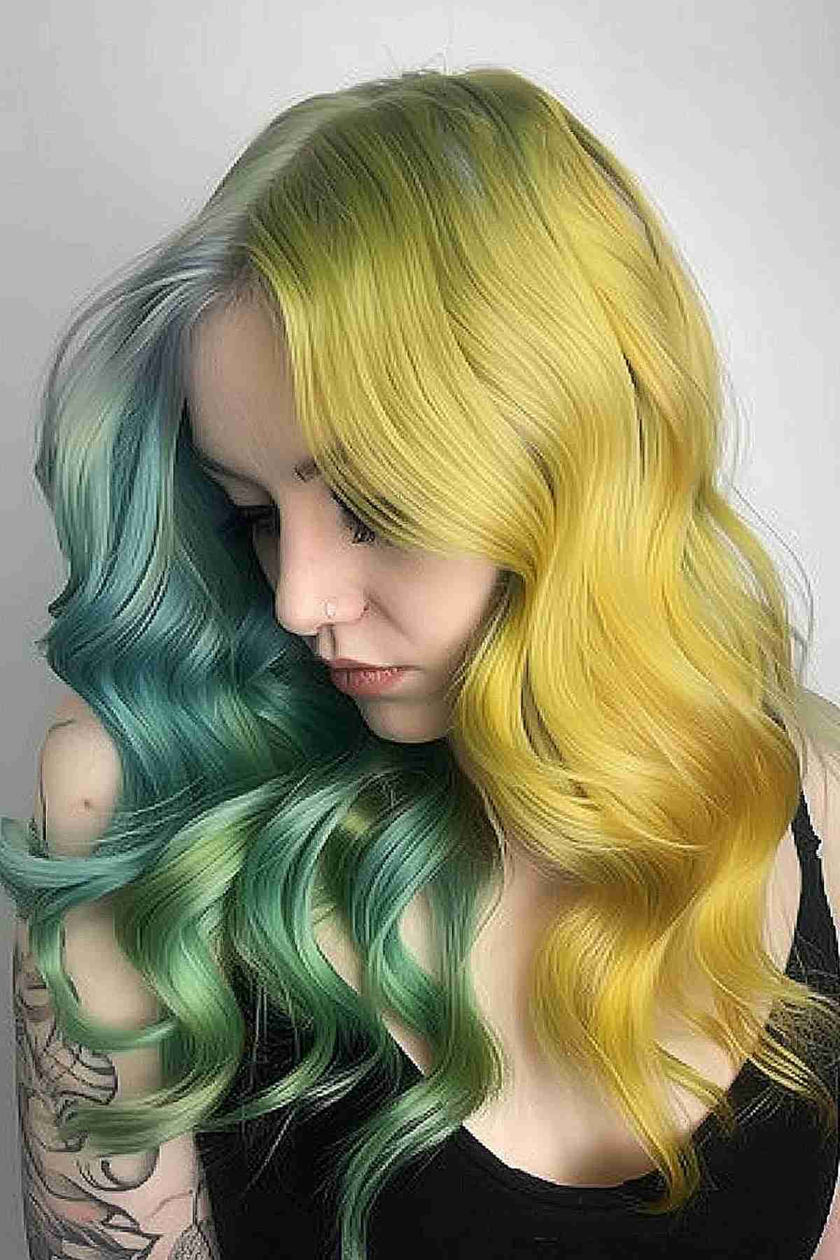 Long wavy hair with split-dye from sunny yellow to aqua green, evoking a spring-into-summer transition