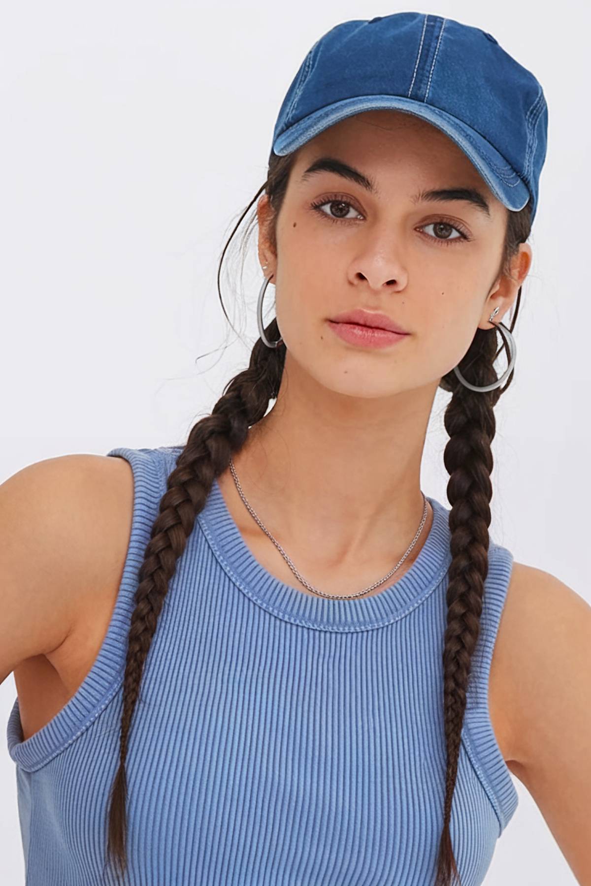 Twin braids with baseball cap