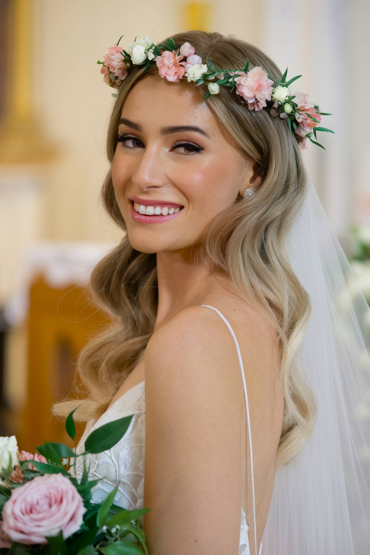 Spring wedding hairstyle with waves and flower crown