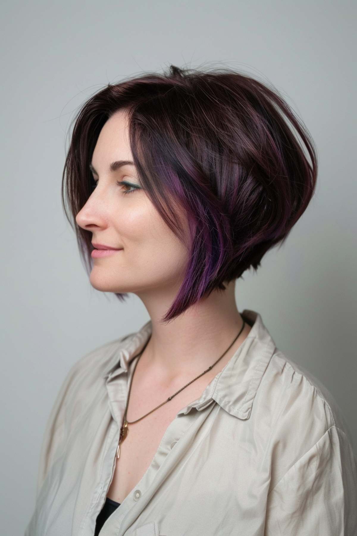 Stacked bob with purple highlights and angled front