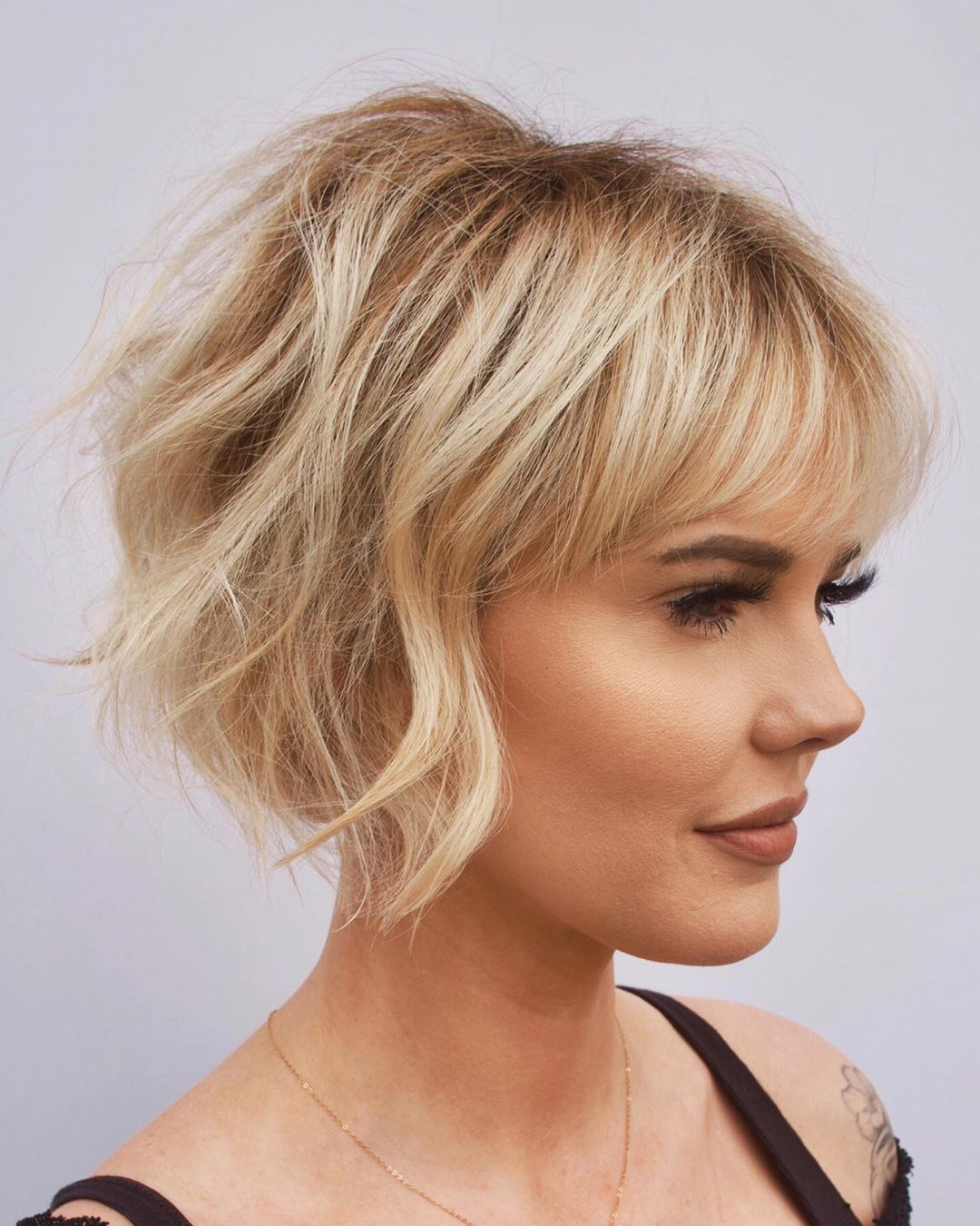 stacked bob with wispy bangs for ladies with thin hair