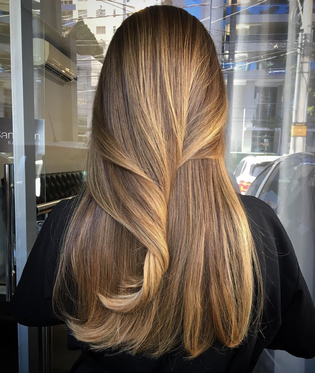 straight cappuccino brown hair with subtle blonde highlights