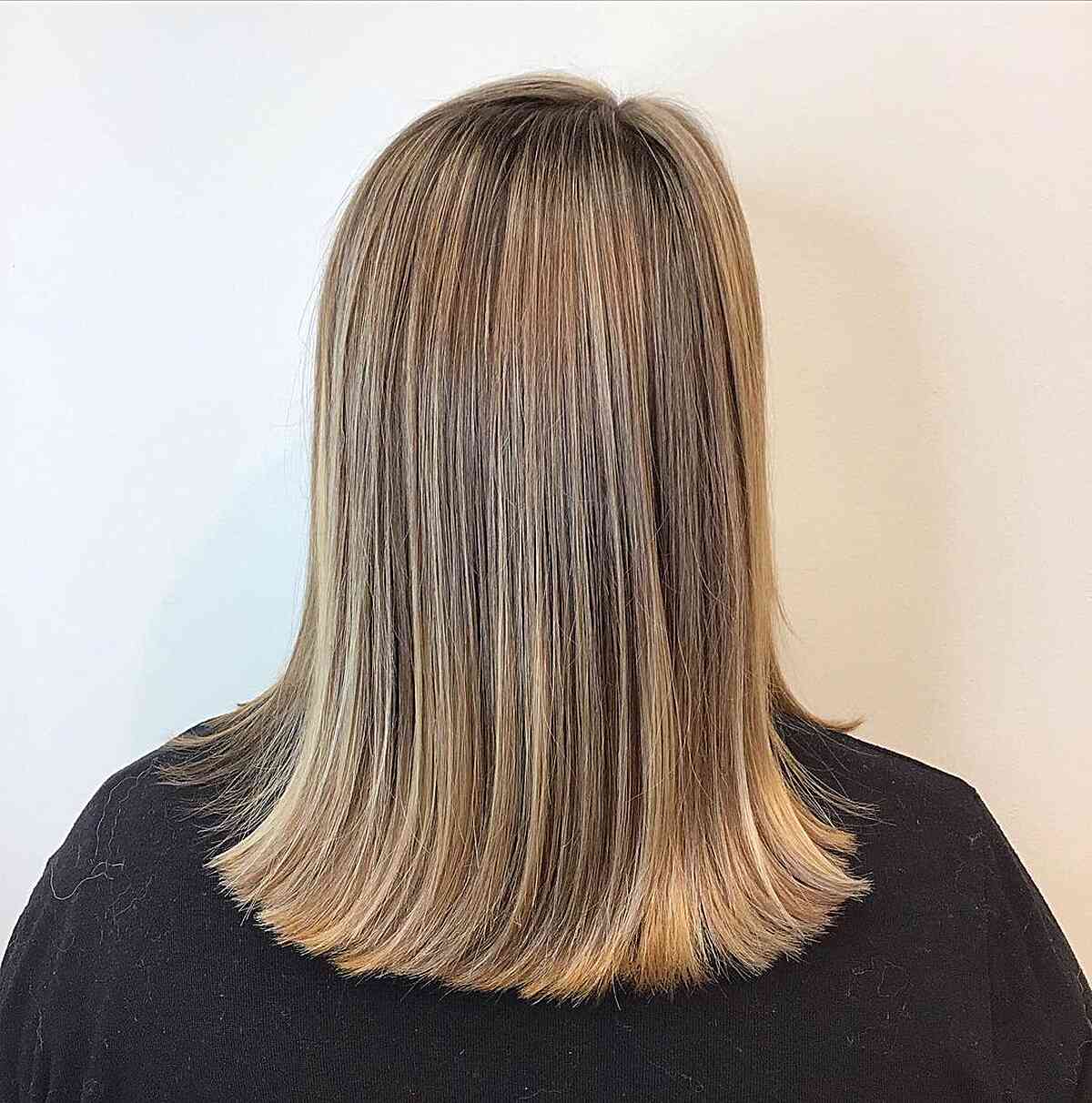 Medium-Length Straight Dark Blonde Balayage Hair with Warm Hues