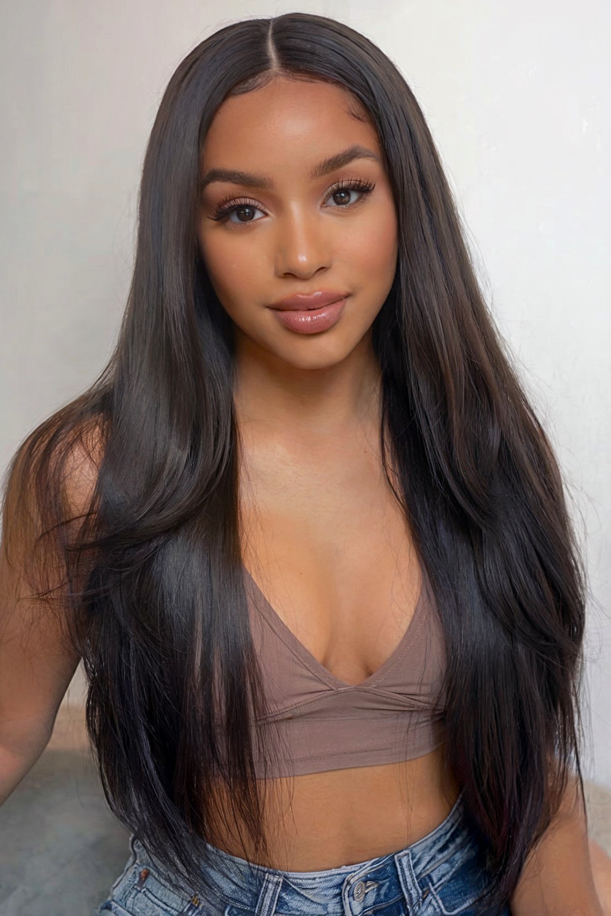 Straight hairstyle for Black women with a middle part