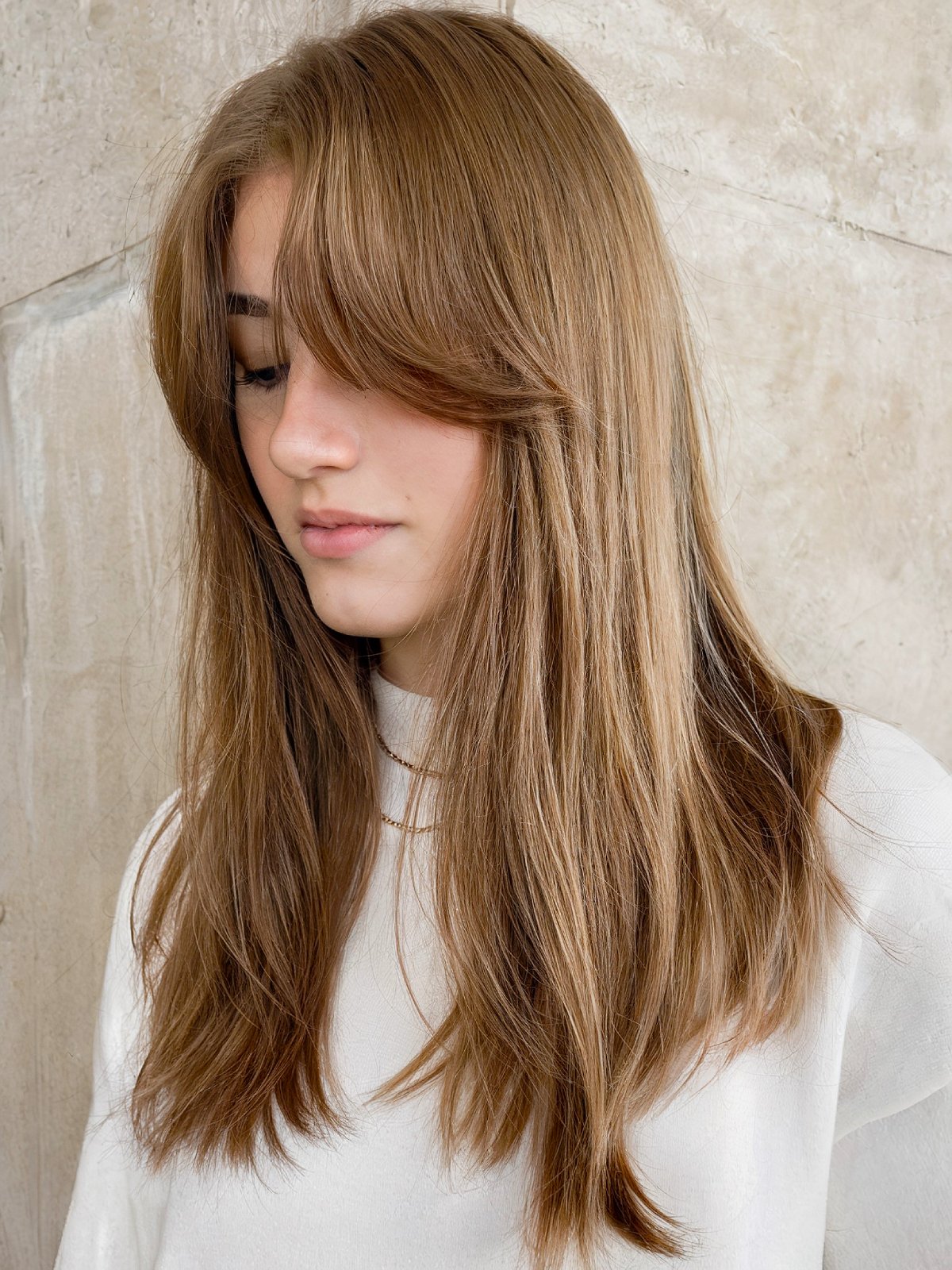 Classic straight hairstyle with curtain bangs