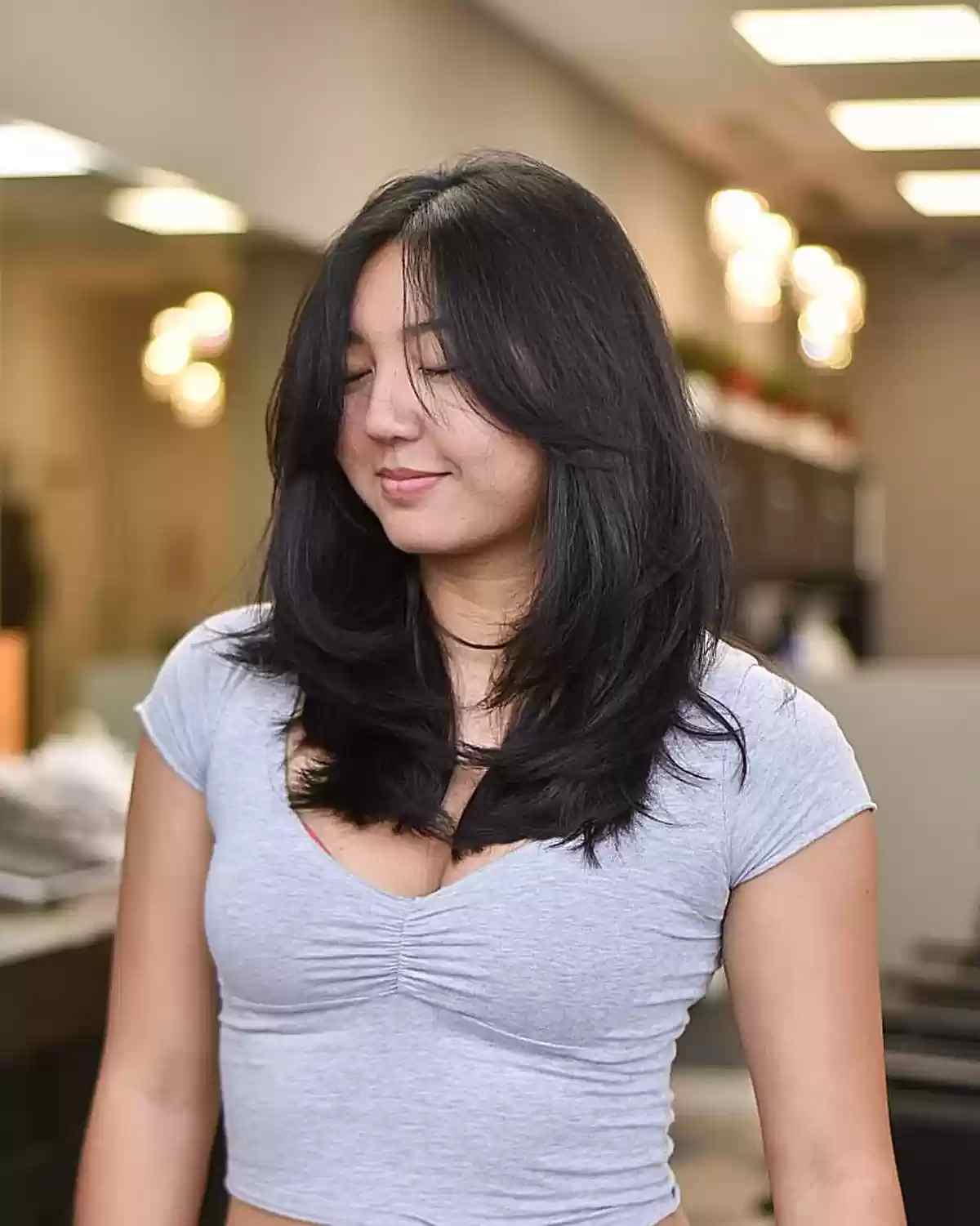 Straight Layered Cut with Face-Framing Bangs and Middle Part on Dense Hair