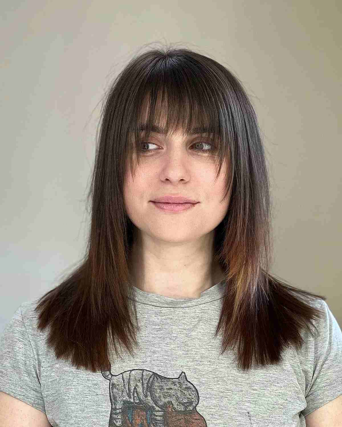 Straight Mid-Length Hair with Wispy Bangs and Layers