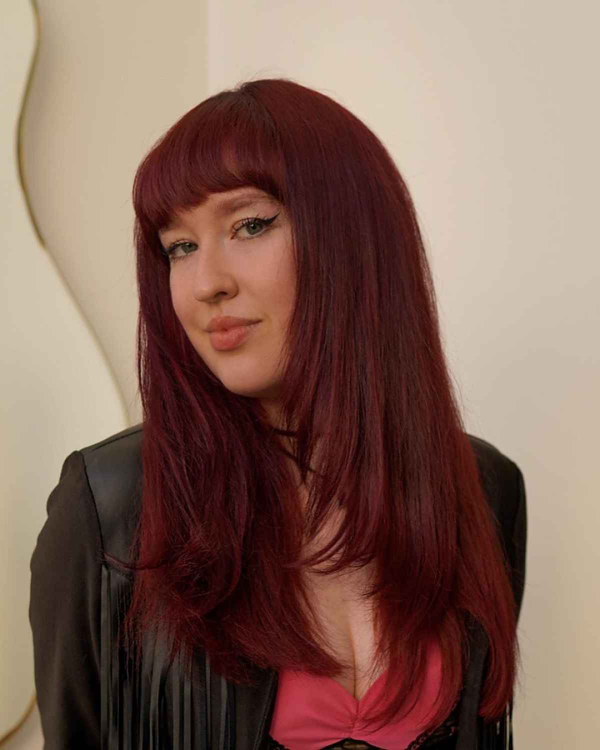 strong long layered red hair with a fringe