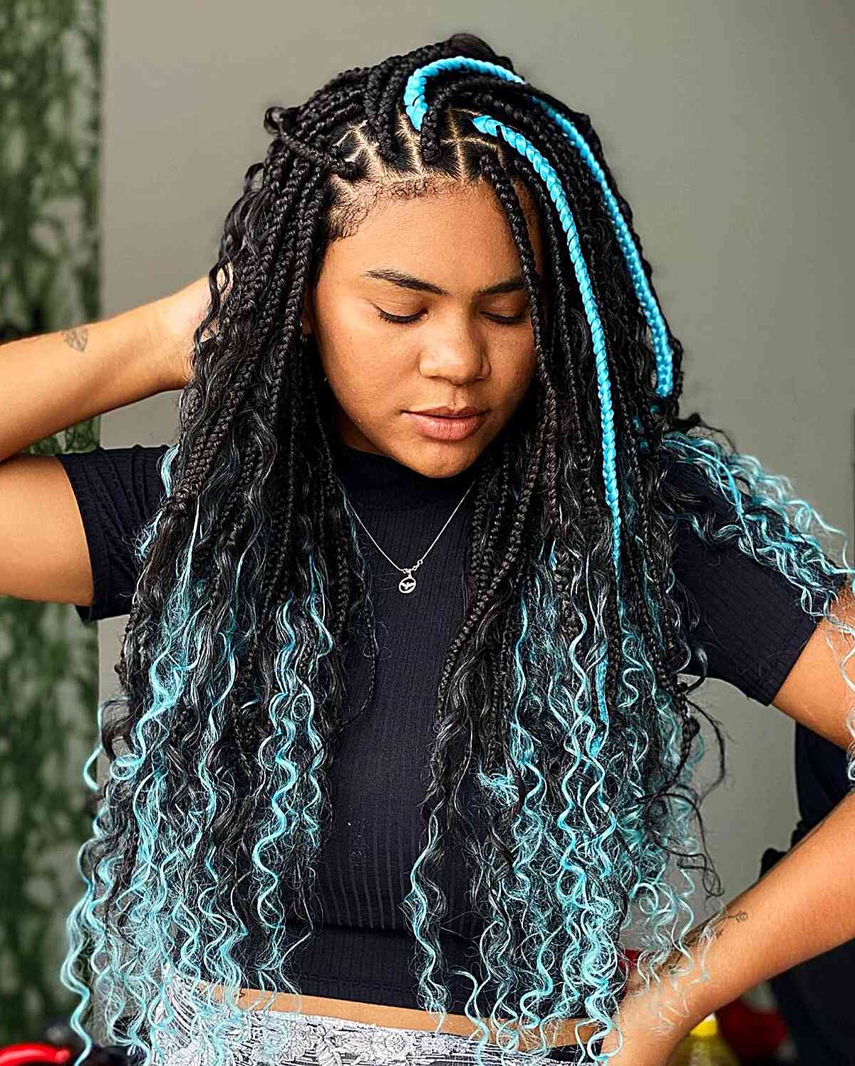 Stunning Box Braids with Teal Highlights for Black Women with curled loose ends