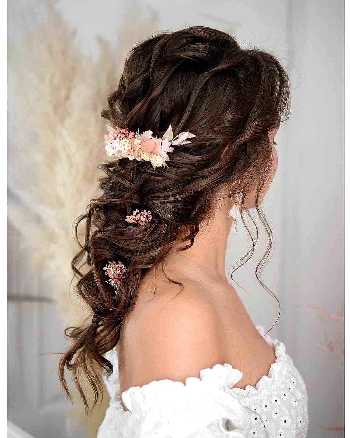 Stunning Messy Braid with Flowers for a Wedding