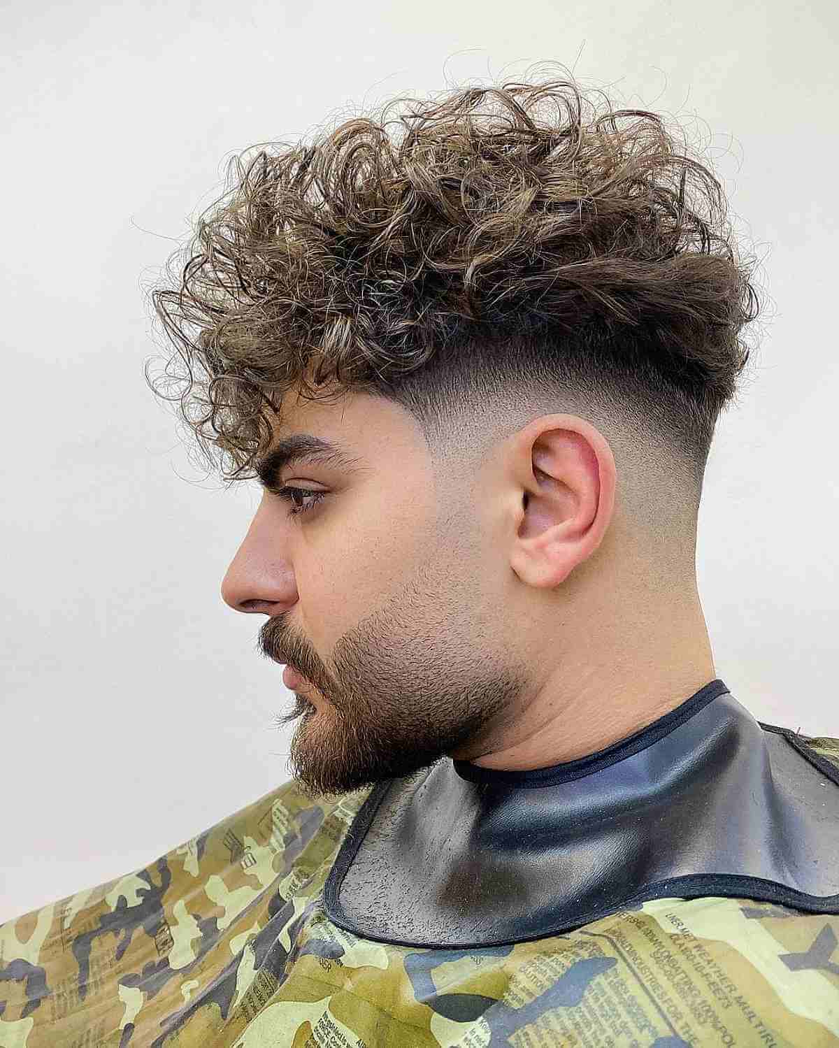 Stylish Medium-Length Curls with a Fade for Men
