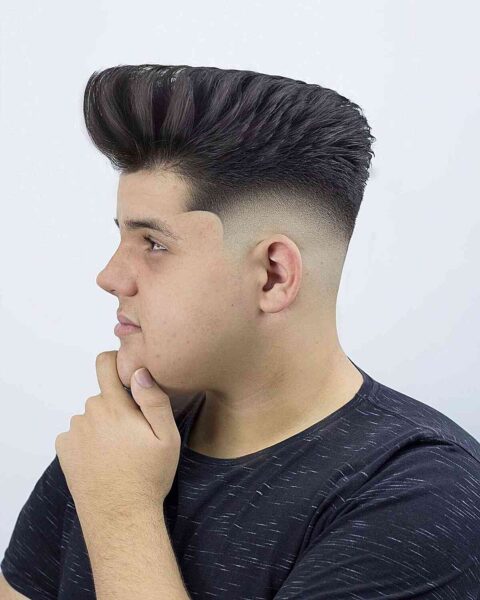 A Suave Bald Fade with a High Top for Teen Boys