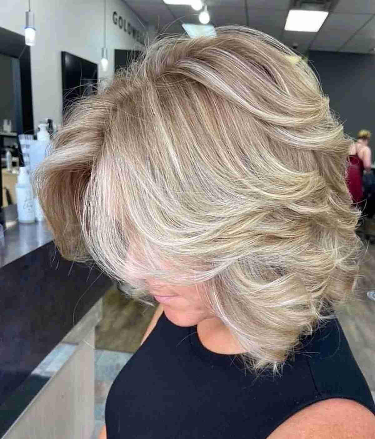 Subtle Blonde Loose Feathered Waves and Layers