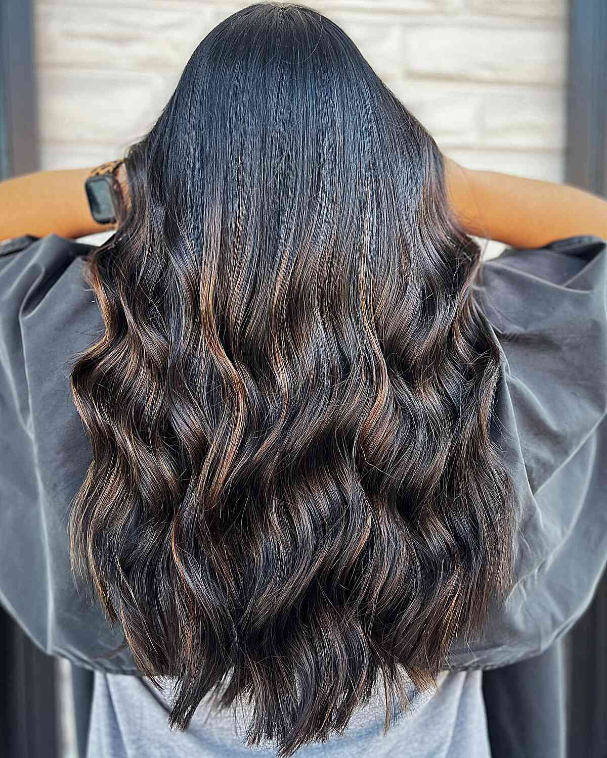 Subtle Caramel Balayage Waves on Long-Length Black Hair