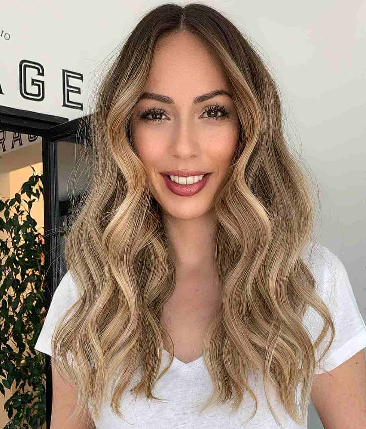 Sun-Kissed Blonde Balayage with Beachy Waves for a Long Face