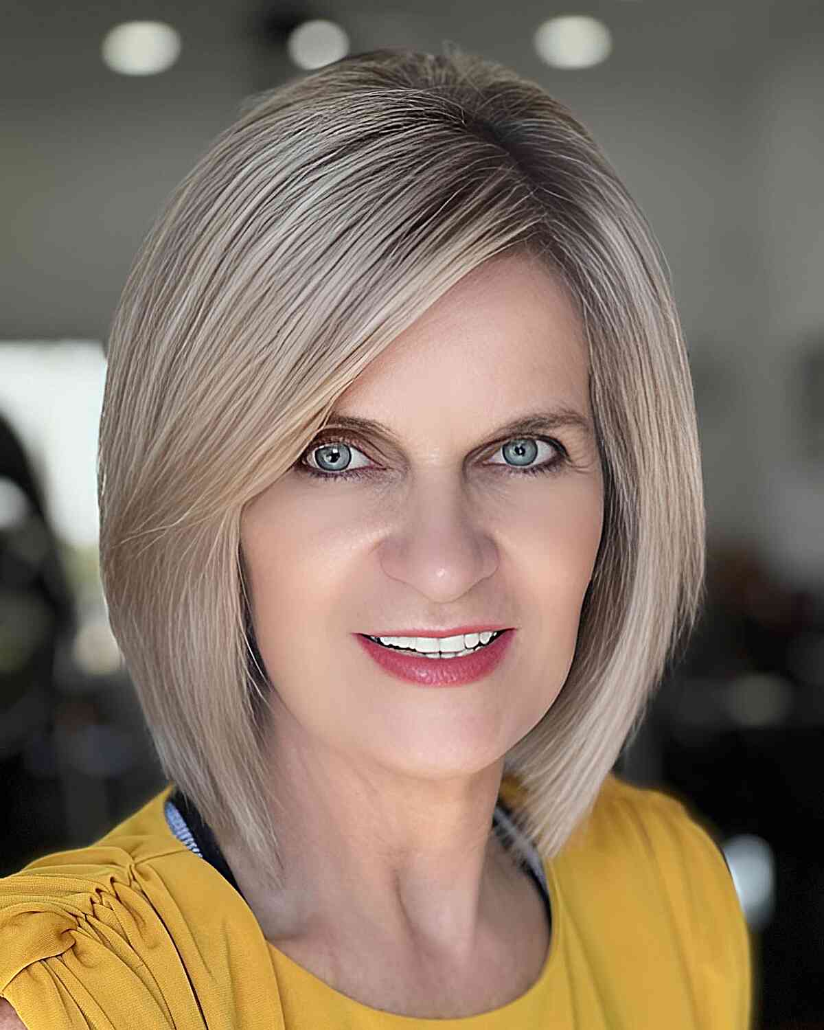 Sweeping Bangs on a Short Layered Bob for women in their 40s with thick hair
