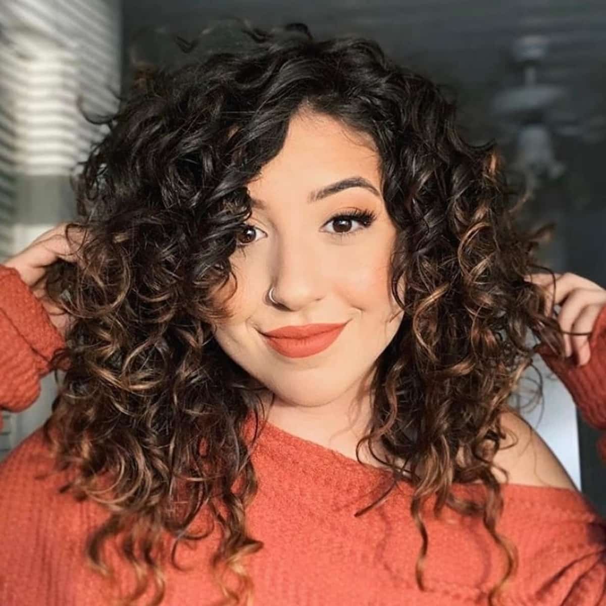 Sweeping fringe for women with curly hair