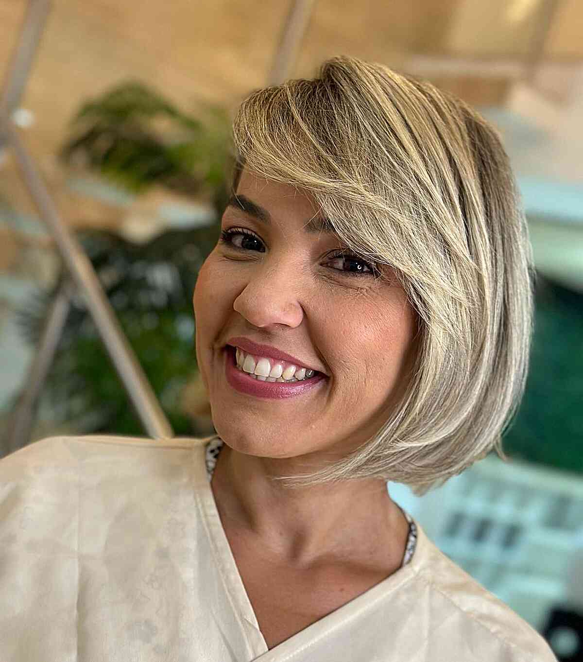 Sweeping Fringe on a Blonde Bob for ladies with thin hair