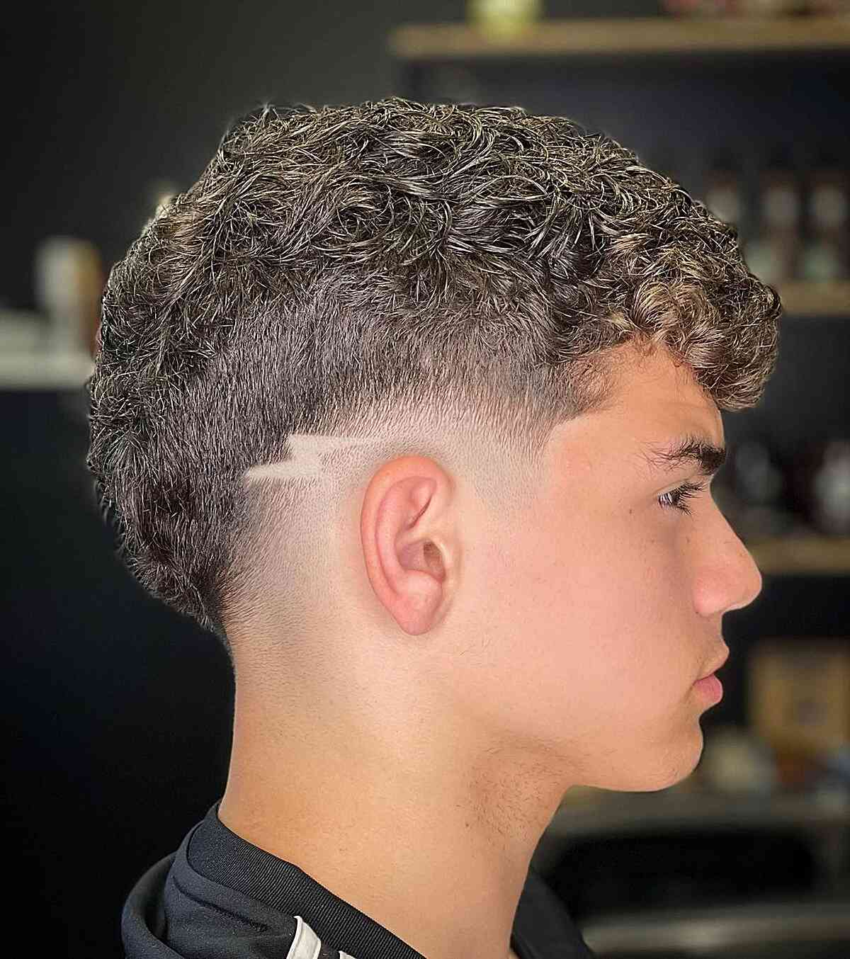 Taper Fade Haircut with a Lighting Bolt Design
