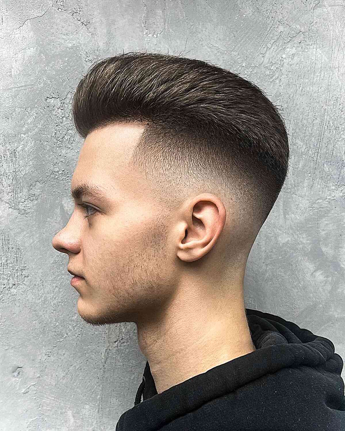 Taper Fade with Voluminous Top for Men with longer hair on top and short sides