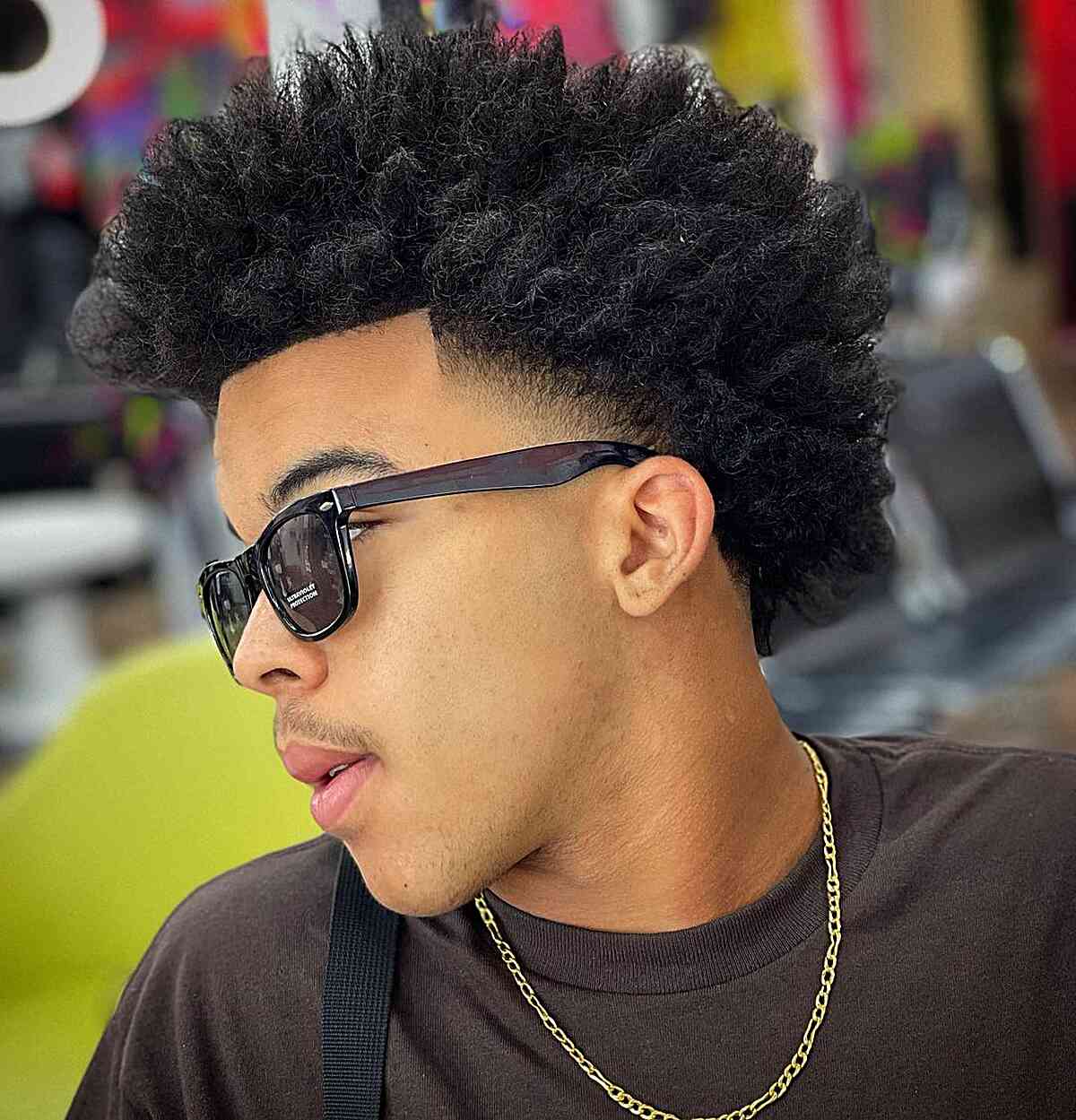Temp Fade with a High Taper for black men with mid-length hair