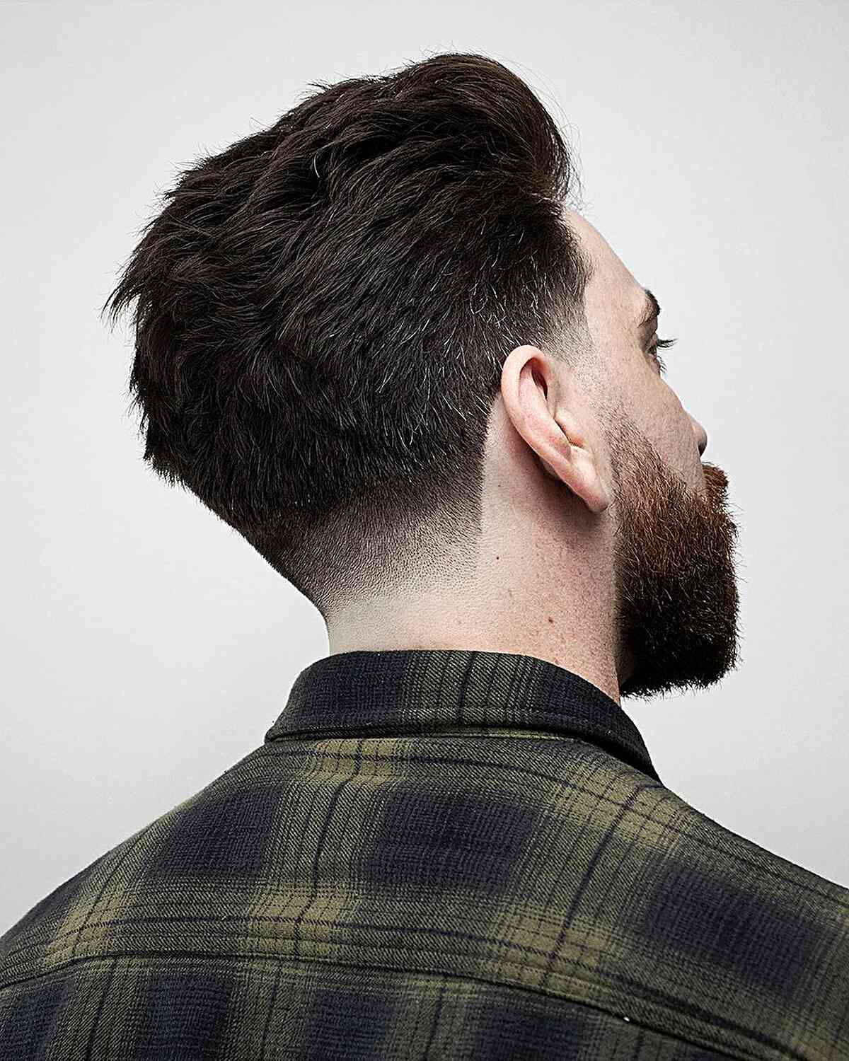 Textured and Low Fade Tapered Haircut for Men with Straight Hair