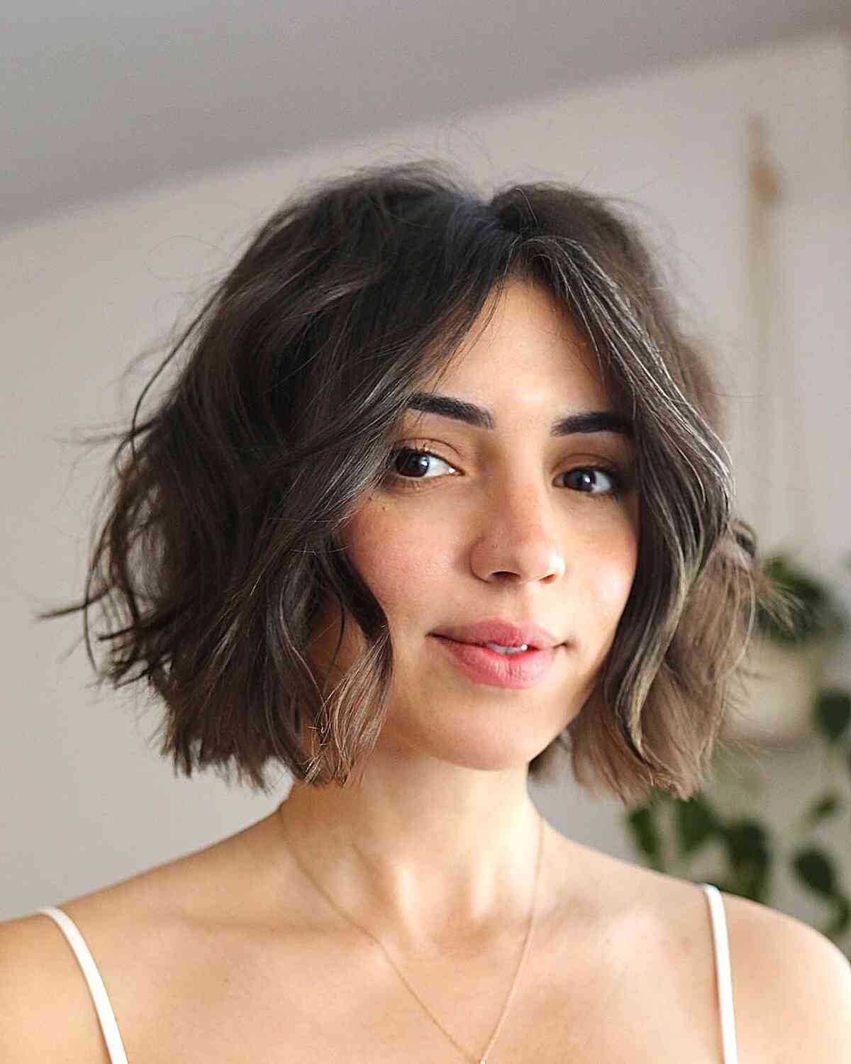 Textured and Messy Short Bob Hairstyle with a center part